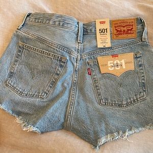 Levi classic 501 Jean shorts in size 28! Never been worn before, new with tags.